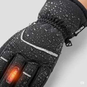 Water droplets beading on a waterproof heated ski glove, demonstrating its protection in wet conditions.