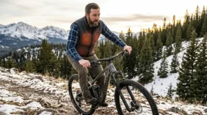 Person wearing a heated vest while cycling to demonstrate high range of motion.