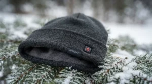 Close-up of a premium heated cap for winter showing the soft fleece lining and control button.