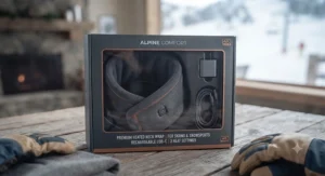The best heated neck wrap for skiing shown neatly packaged with its charging accessories.