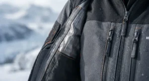 Close-up of the durable, weather-resistant fabric of a heated suit designed for extreme cold environments.