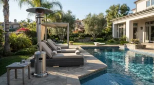 A sleek fire sense propane heater providing comfortable heat next to a backyard swimming pool setup.