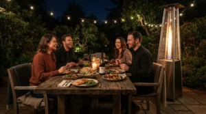 A portable pellet patio heater warming people gathered around an outdoor dining table in winter